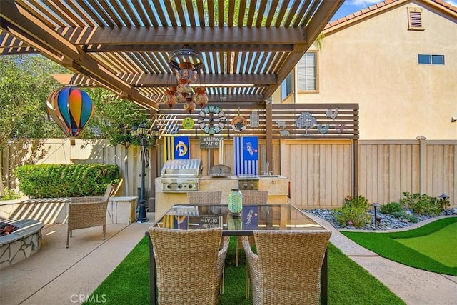 view of patio / terrace with an outdoor kitchen, area for grilling, a pergola, and sink