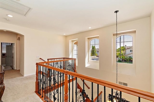 hallway with light carpet