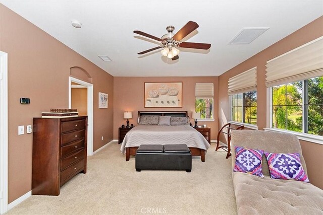 bedroom featuring light colored carpet and ceiling fan