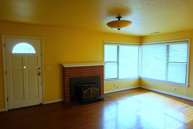 unfurnished living room featuring hardwood / wood-style flooring