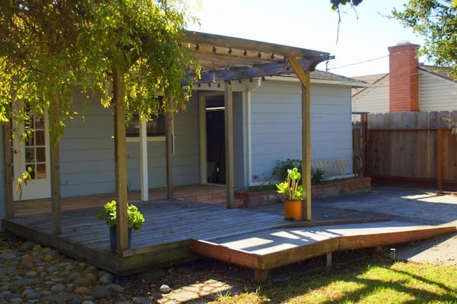 view of outdoor structure with a pergola