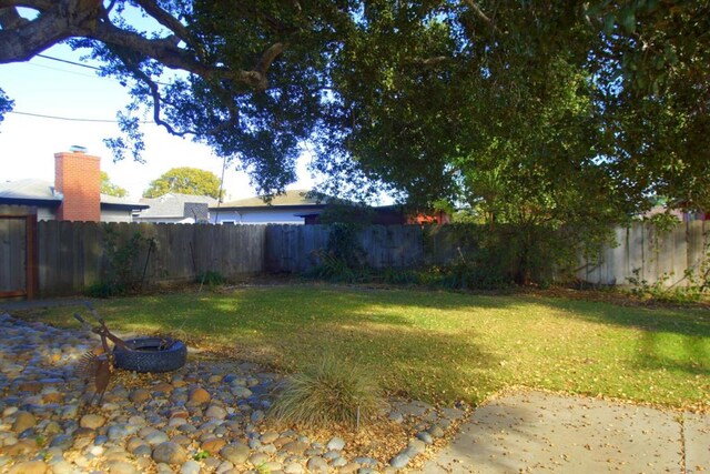 view of yard with an outdoor fire pit