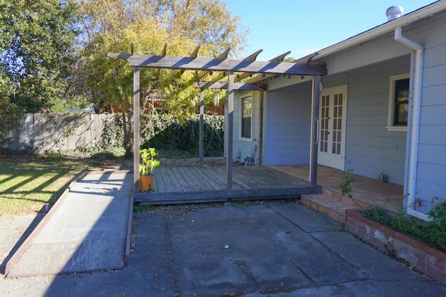 view of patio / terrace featuring french doors, a pergola, and a wooden deck