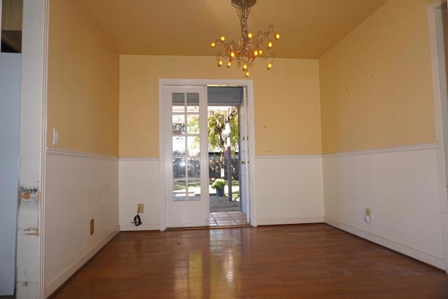 interior space with dark hardwood / wood-style flooring and a notable chandelier