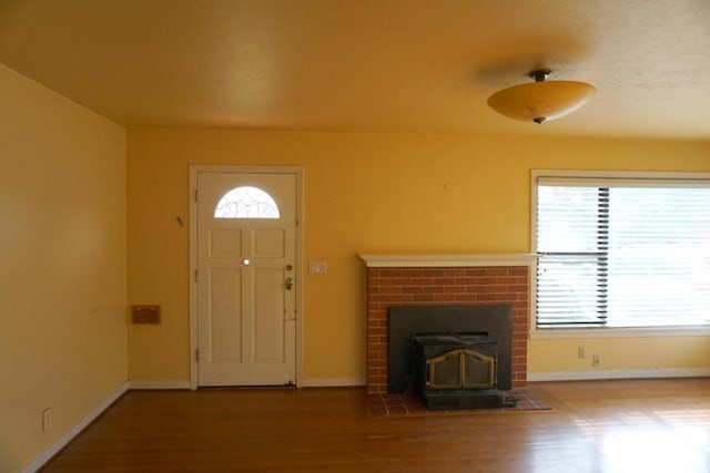 entrance foyer featuring a wealth of natural light and hardwood / wood-style floors