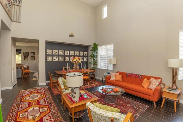 living room featuring a high ceiling