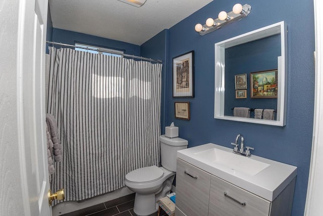 bathroom with vanity, a textured ceiling, a shower with curtain, tile patterned floors, and toilet