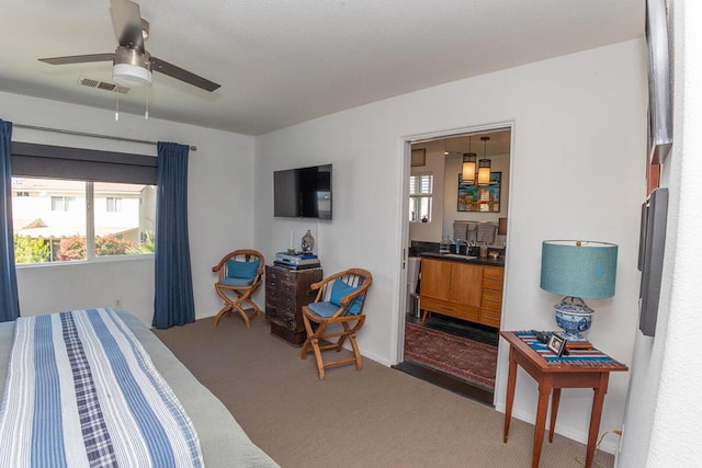 bedroom with sink, ceiling fan, and carpet