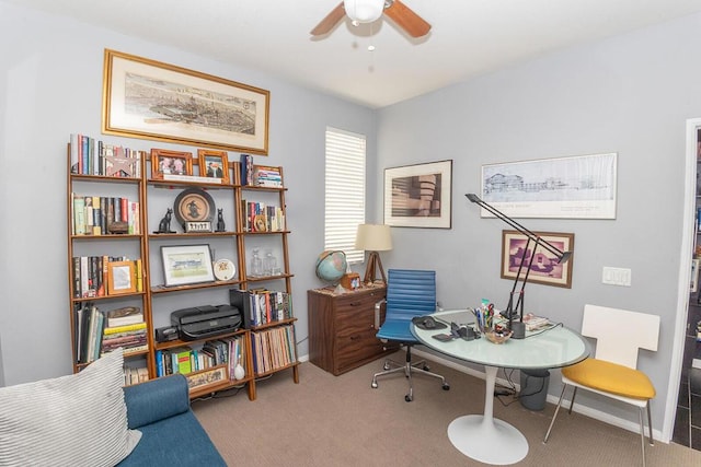 carpeted home office with ceiling fan