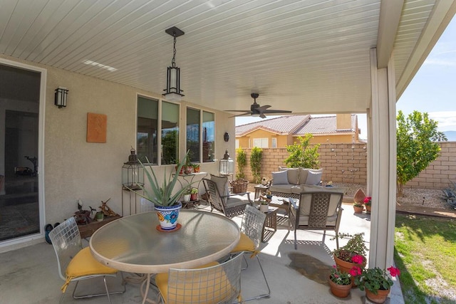 view of patio / terrace with ceiling fan and outdoor lounge area