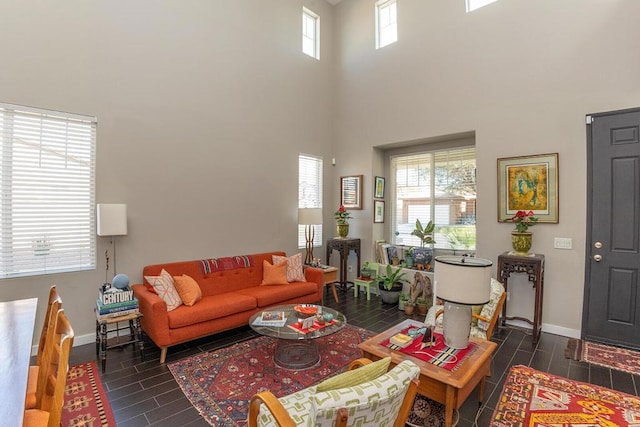 living room featuring a towering ceiling