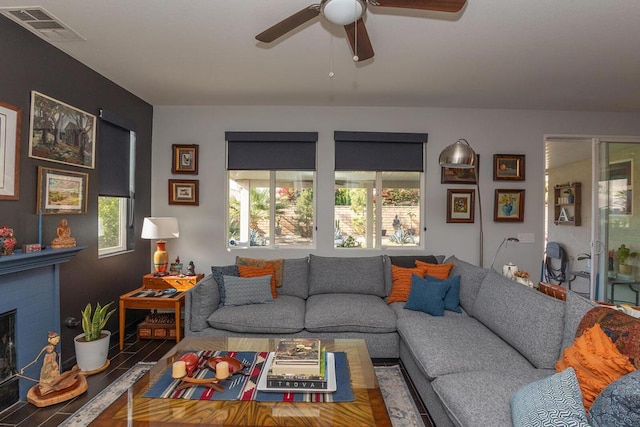 living room featuring ceiling fan and wood-type flooring