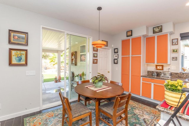 dining room with dark hardwood / wood-style flooring