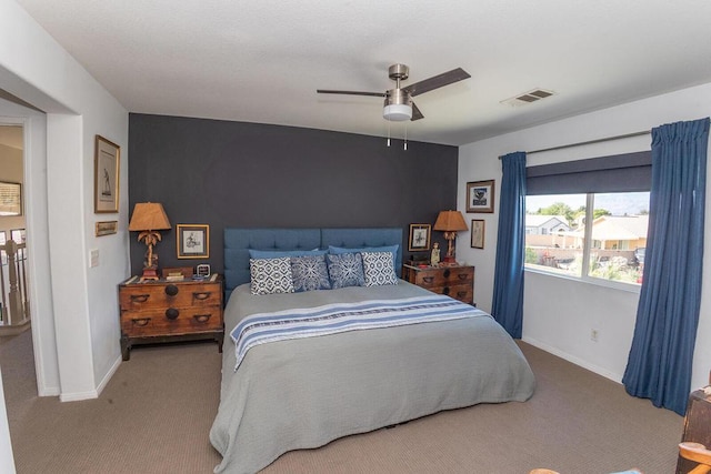 carpeted bedroom with ceiling fan