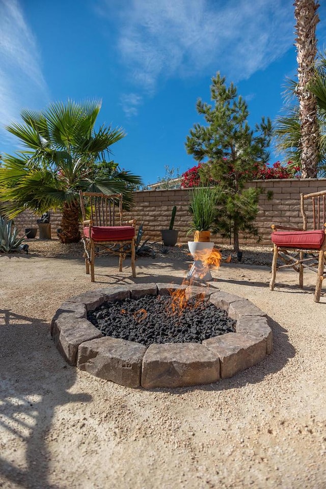 view of yard featuring a fire pit and a patio area