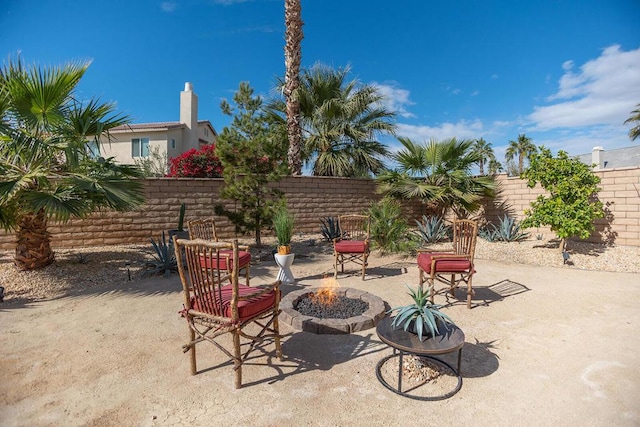 view of patio with a fire pit