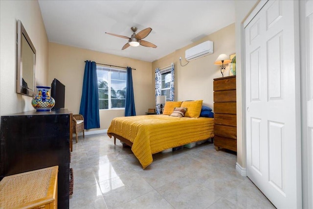 bedroom with a wall mounted air conditioner, a closet, and ceiling fan