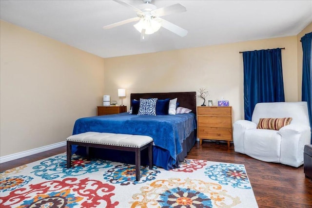 bedroom with ceiling fan and dark wood-type flooring