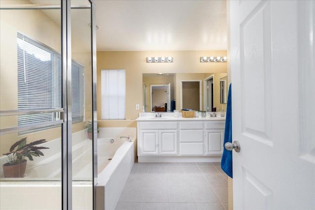 bathroom featuring tile patterned floors, vanity, and independent shower and bath