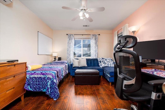 bedroom featuring ceiling fan and dark hardwood / wood-style flooring