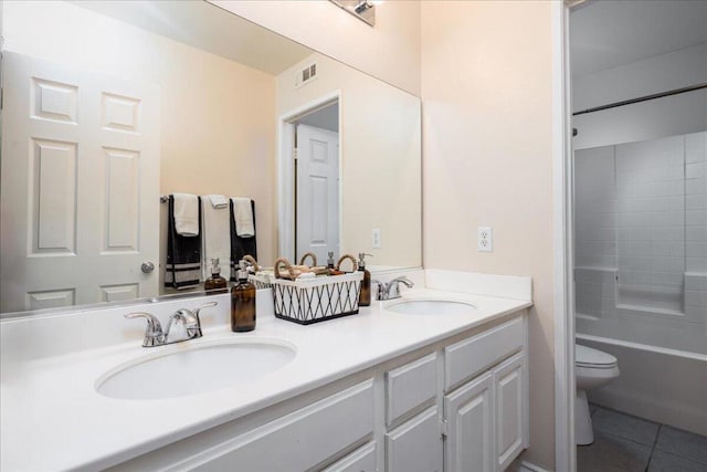 full bathroom with tile patterned floors, vanity, toilet, and tub / shower combination