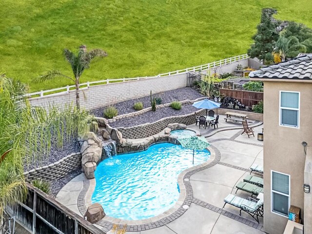 view of swimming pool with a patio area and pool water feature