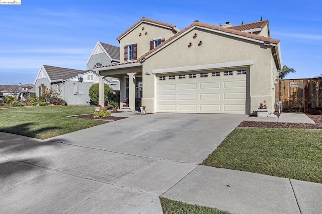 view of front of property with a garage and a front lawn