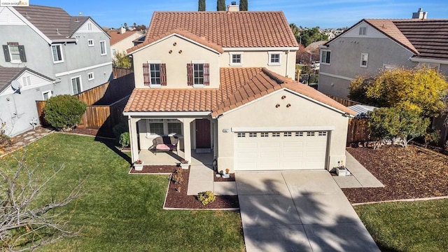 view of front of home featuring a garage and a front yard