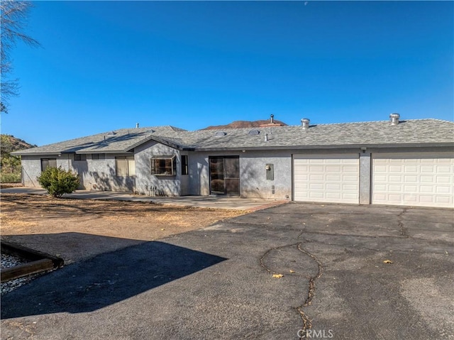 single story home with a garage