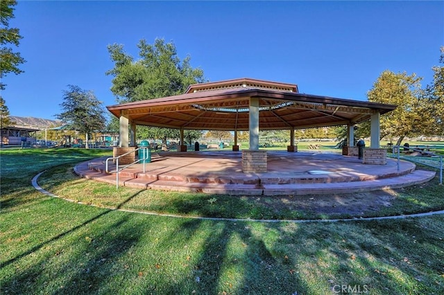 view of home's community with a gazebo and a yard