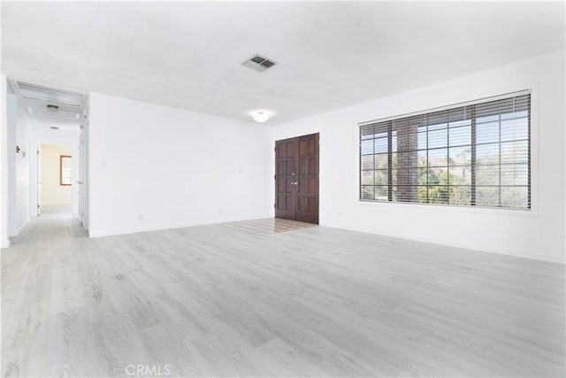 spare room featuring light hardwood / wood-style floors