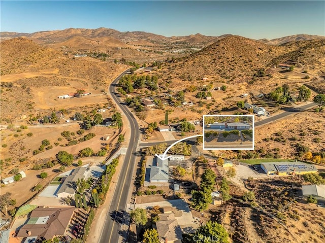 drone / aerial view featuring a mountain view