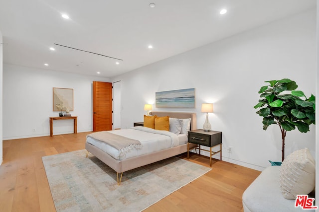 bedroom featuring light wood-type flooring