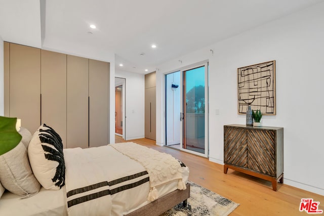 bedroom with a closet and light wood-type flooring