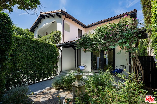 back of house featuring french doors