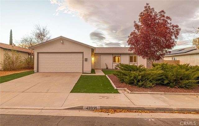 ranch-style home featuring a garage