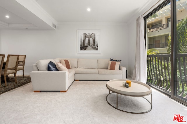 carpeted living room featuring crown molding