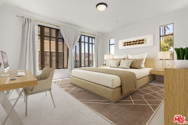 bedroom featuring dark carpet and ornamental molding