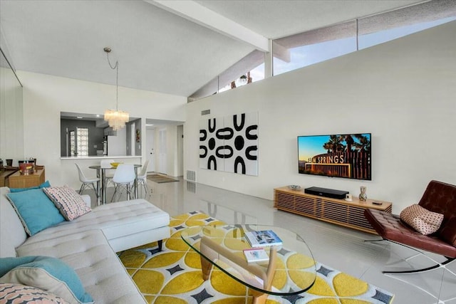 living room featuring beamed ceiling, high vaulted ceiling, an inviting chandelier, and a wealth of natural light