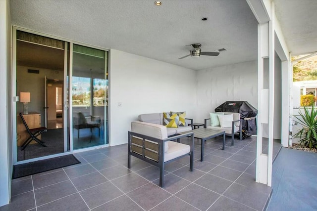 view of patio with ceiling fan and area for grilling