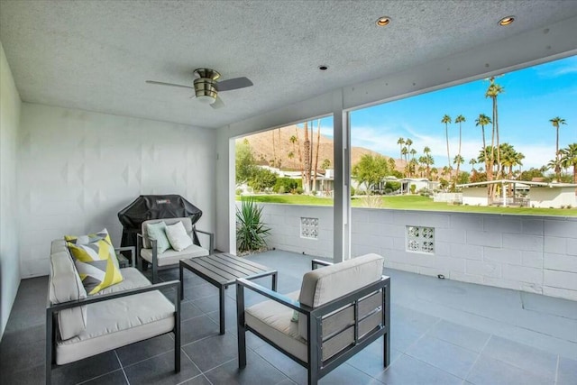 view of patio / terrace featuring an outdoor living space and ceiling fan