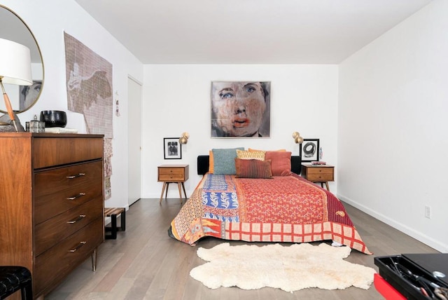 bedroom with hardwood / wood-style flooring