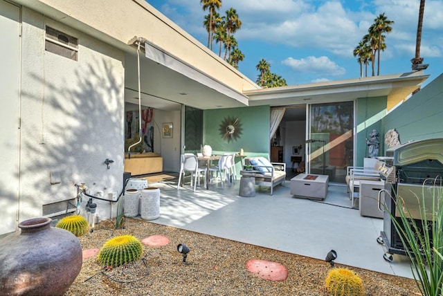 view of patio / terrace featuring a fire pit