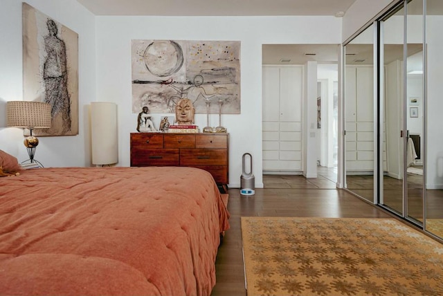 bedroom featuring dark hardwood / wood-style flooring