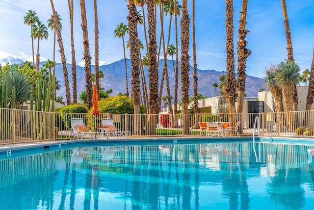 view of pool with a mountain view