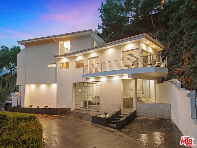 view of front of home with a balcony