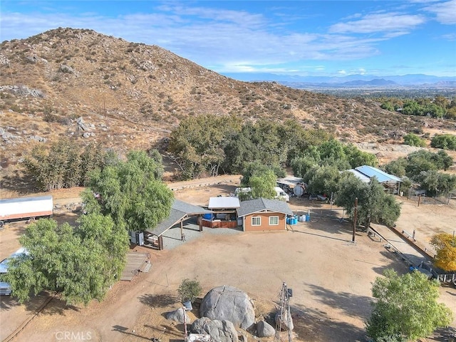 birds eye view of property with a mountain view