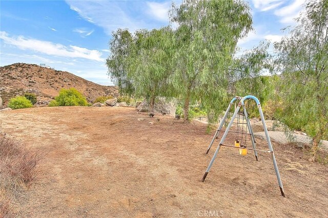 view of play area featuring a mountain view