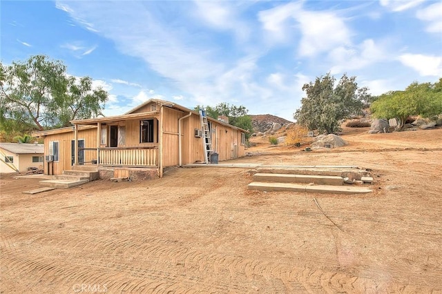 view of front of house with a mountain view and covered porch