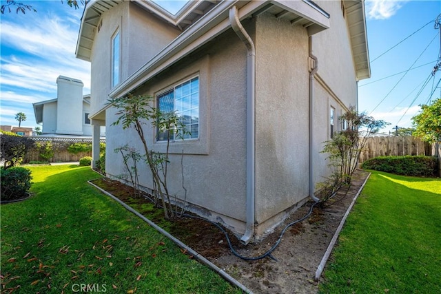 view of home's exterior featuring a yard